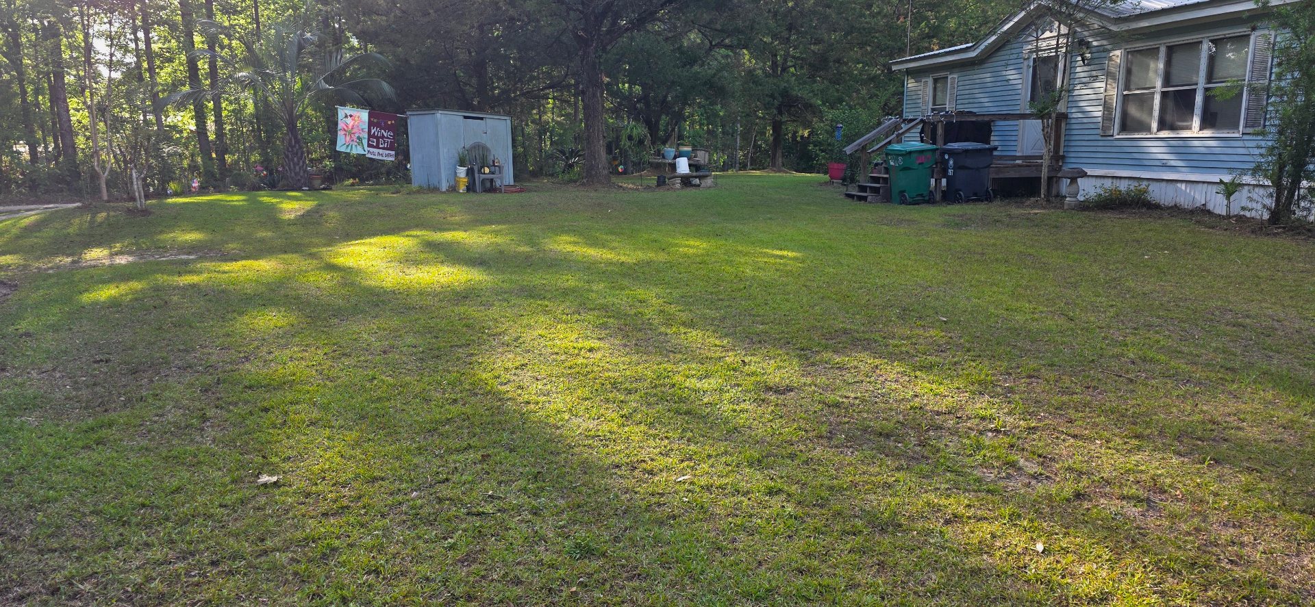 Freshly mowed striped lawn outside a home in Laurel Hill, FL