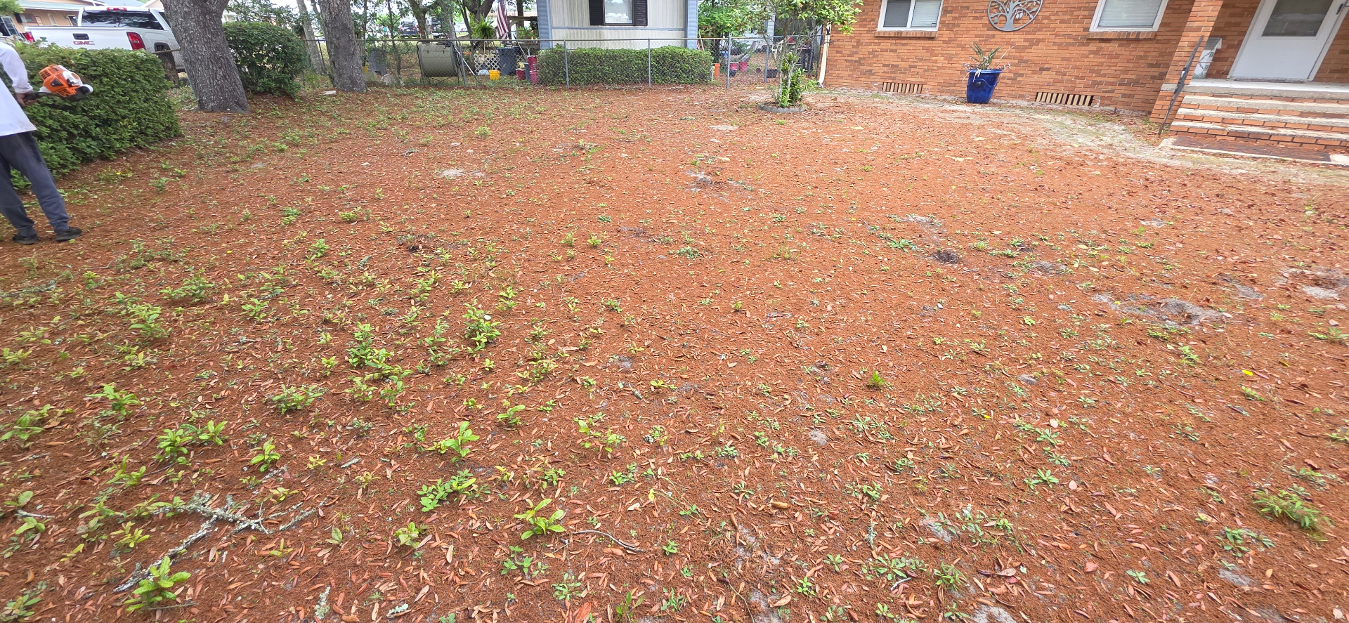 Lady Edge crew member blowing debris during a yard cleanup in Okaloosa County, FL
